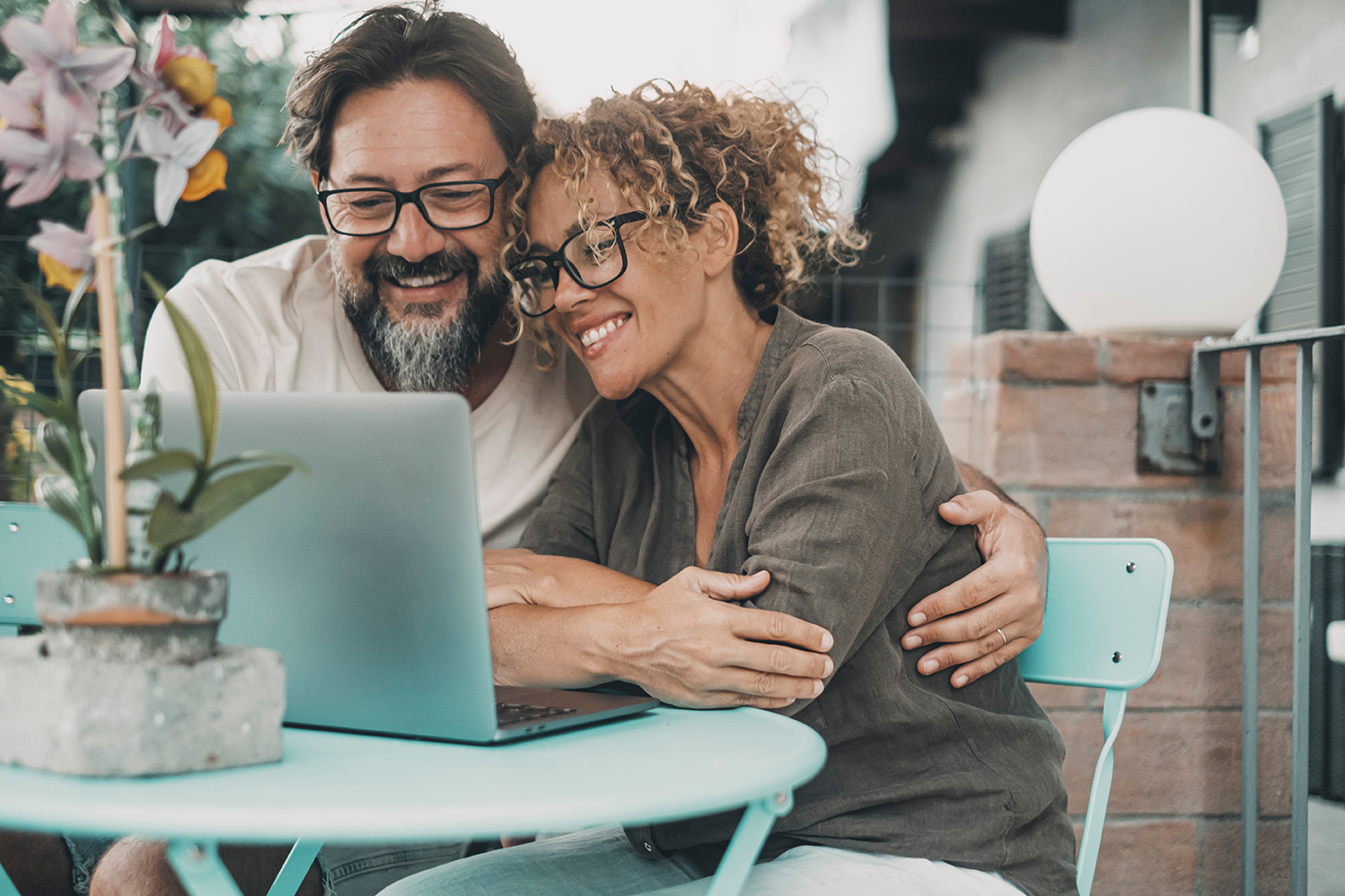 One couple middle age enjoy and have fun together using laptop smiling